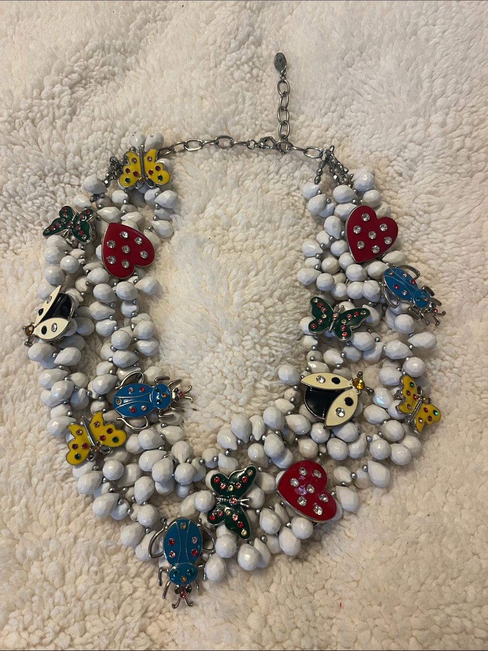 White Beaded Statement Necklace with Colorful Charms